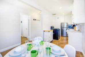 A modern kitchen with a refrigerator, stove, and microwave. - Short Walk To Sand, Prefect for Families, Large Deck! (Newport Beach)