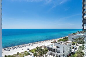 A beachfront hotel with a pool, beach, and ocean view. - Beachfront Nirvana | Corner View • Pool • Gym (Hollywood)