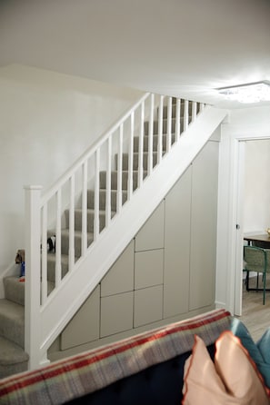 A staircase with white railings leading to a landing. - New 3 Bed House | Stafford | Private Parking (Stafford)