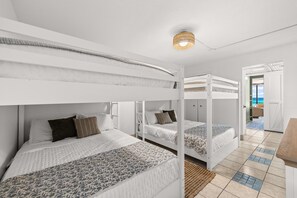 A bunk bed room with a view of the sea. - 🏝️ Windward 108 🌊 Beach Front 🏖️ Pools 🏊 Snowbird Friendly ☀️ (Panama City Beach)
