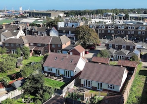 A residential area with houses, a marina, and a clear sky. - The Mill House Apartment (Lowestoft)