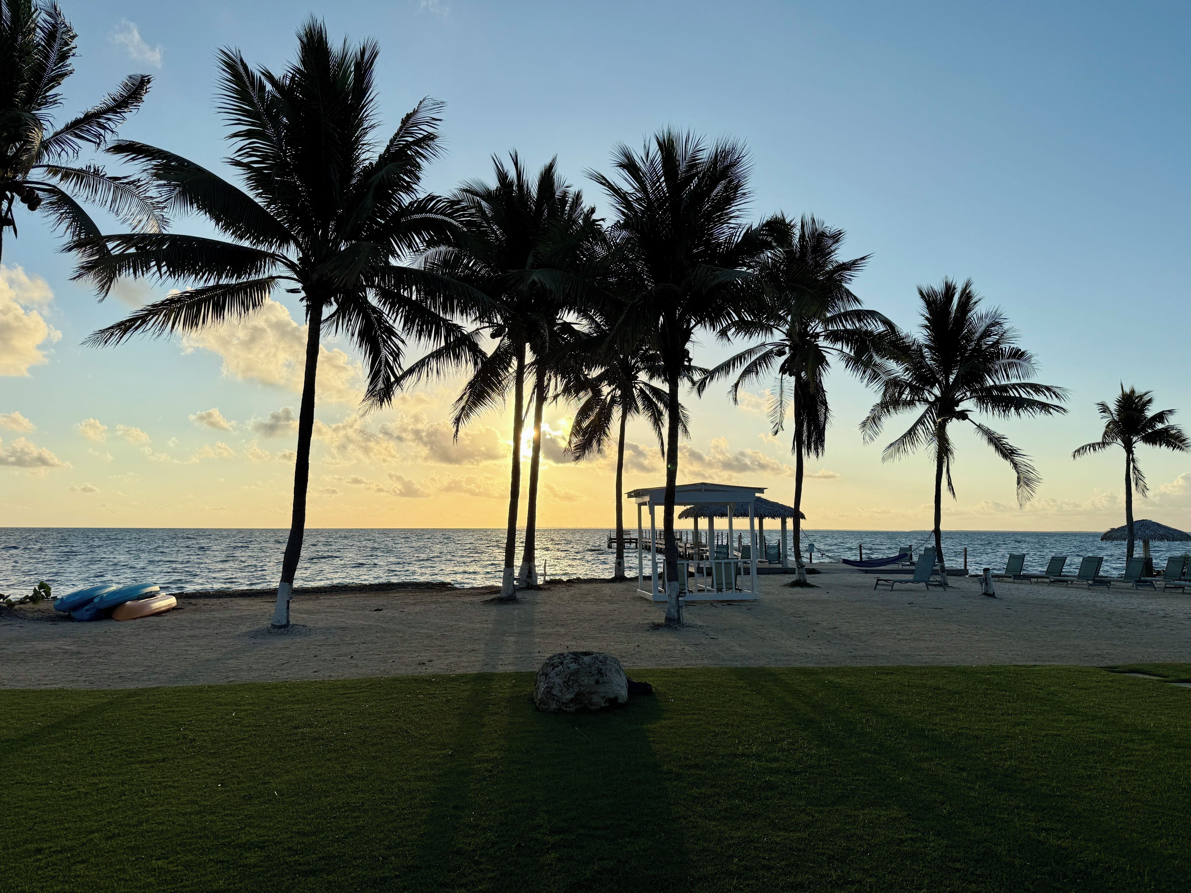 Soak up tropical serenity as the sun melts into sea.