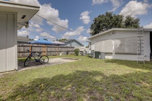 A residential area with a fenced yard, a bicycle, and a covered patio area. - 5 Mi to Ocean! Snowbird Haven in Lake Worth Beach (Lake Worth)