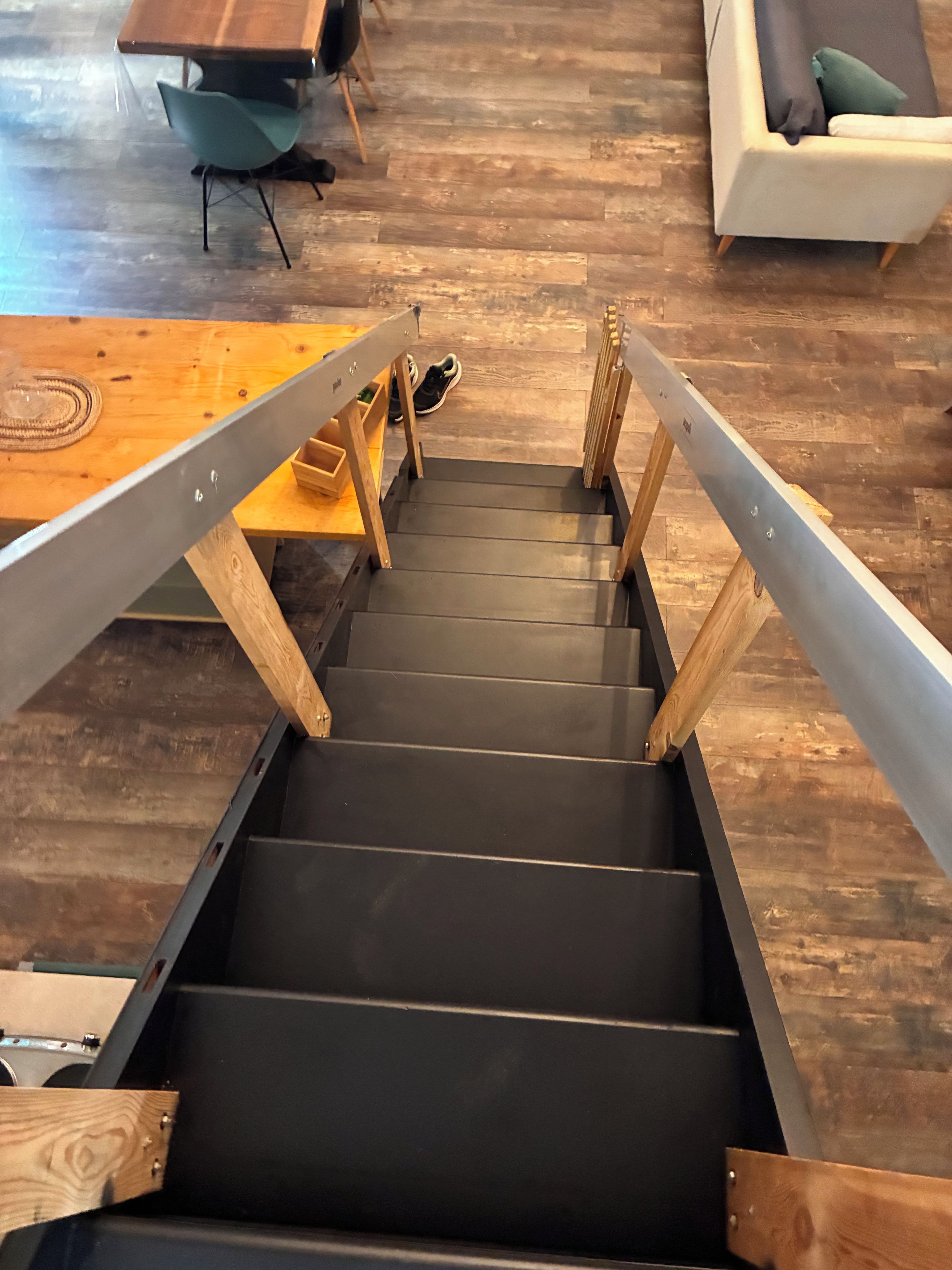 A staircase with wooden railings leading to a lower level.