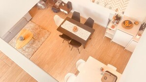 A modern kitchen with a dining area, a small rug, and a fan. - Villa With Pool Torrevieja (Torrevieja)