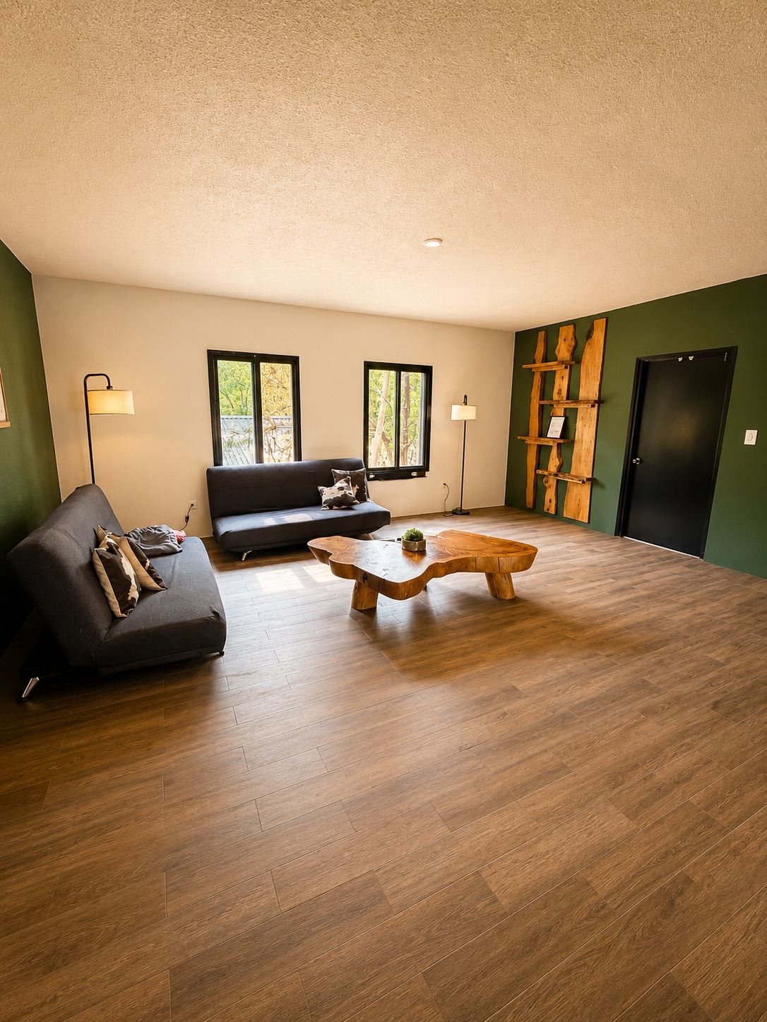 A modern living room with a sofa, a wooden coffee table, and a bench.