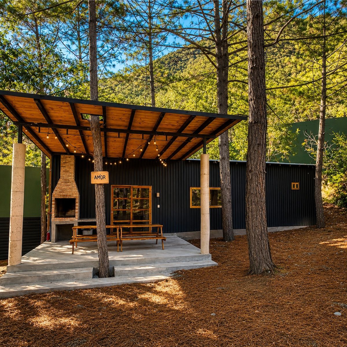 An outdoor wooden structure with a bench and a sign that reads 'AMOR'.