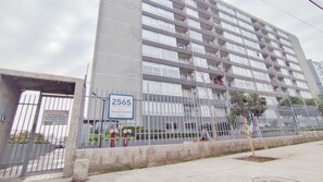 A multi-story residential building with a sign indicating the address 2565. - Domingo Santa Maria by Domus Travels (Santiago)