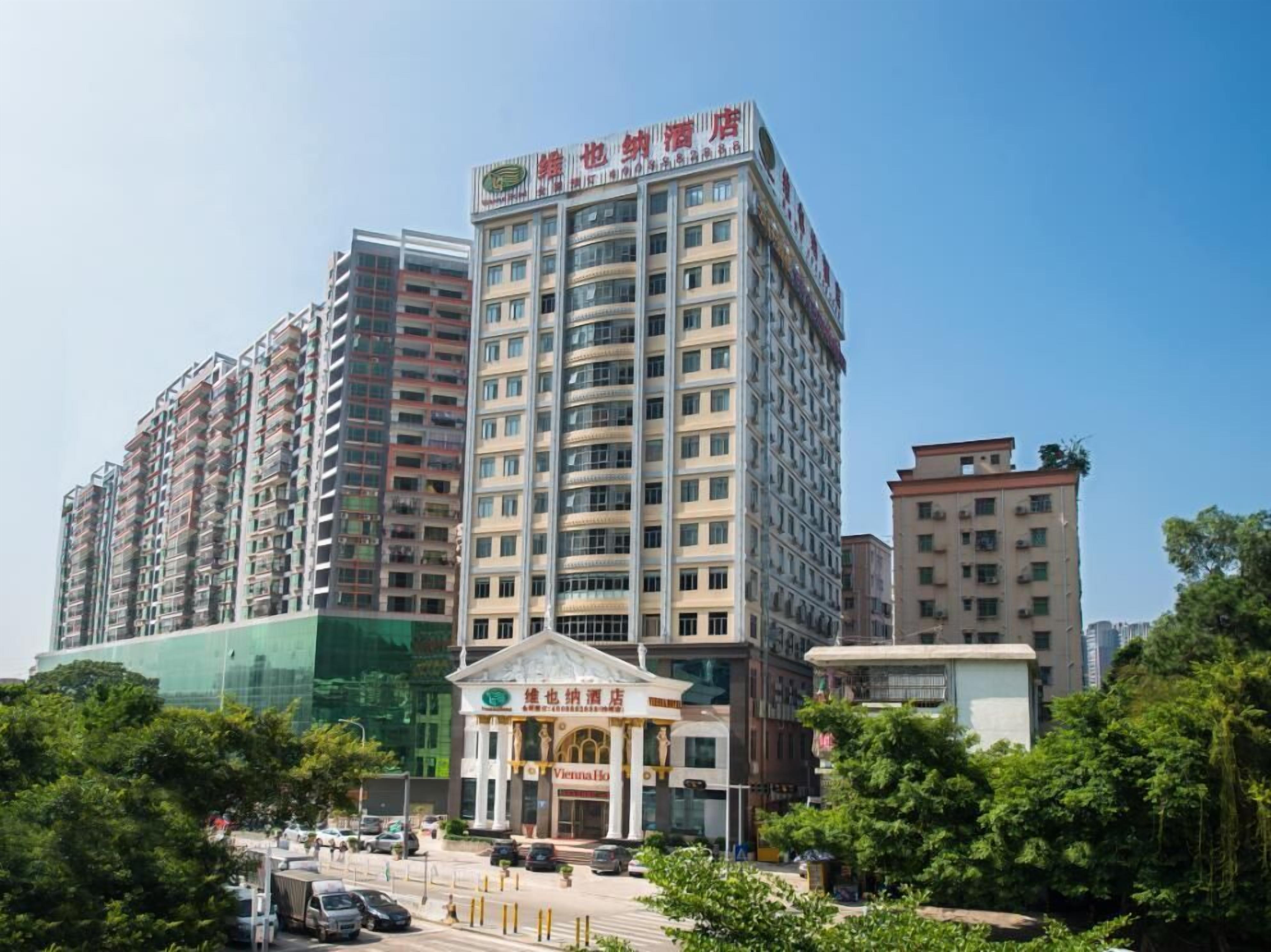 A multi-story hotel with a prominent entrance and signage.