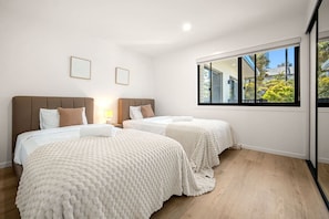 A hotel room with two beds, a large window, and a view of the outside. - Brand-New|Walk to Cavill & Beach| Glink |Full A/C (Surfers Paradise)