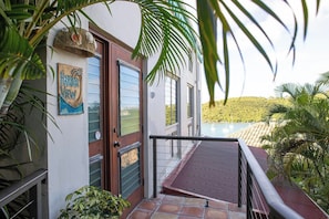 A building with a sign reading 'Hendrick View' and a balcony with a view of a body of water and greenery. - Harbor View at Battery Hill •  Cruz Bay Views • Pool • Walk to Town & Beach (Saint John)