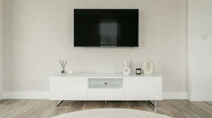 A modern living room with a flat-screen TV mounted on the wall, a white console table with decorative items, and a wooden floor. - Modern 2-Bed Greenwich Apartment Fast Links to Canary Wharf (London)