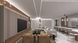 Ein modernes Wohnzimmer mit Flachbildfernseher, Sofa, Couchtisch und Essbereich mit Stühlen.