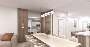 A modern dining area with a long table, chairs, and a decorative light fixture. - Brand New 8BR | Disney-Themed Home (Clermont)