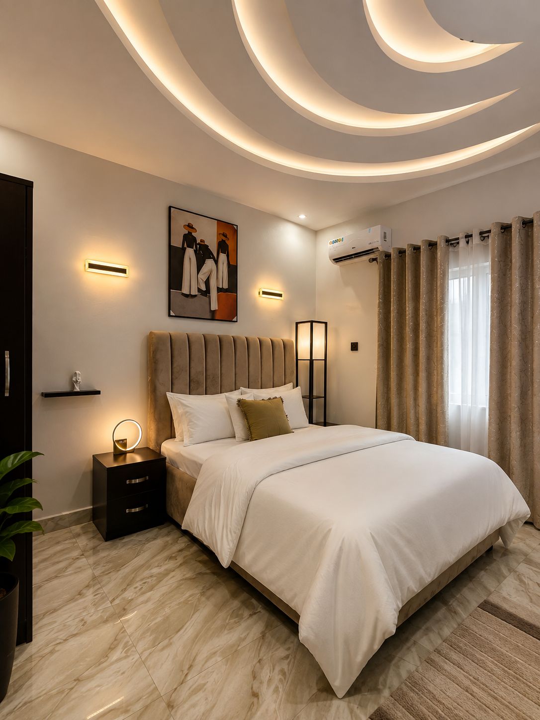 A modern bedroom with a large bed, bedside tables, a wall-mounted air conditioner, and a painting.