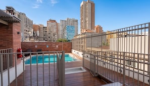 A rooftop pool with a view of surrounding high-rise buildings. - Torre Manuel Rodriguez by Domus Travels (Santiago)