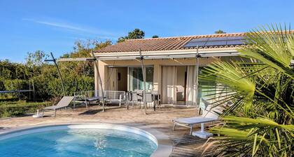 Bright studio with a terrace, pool, and large, fenced-in lot.