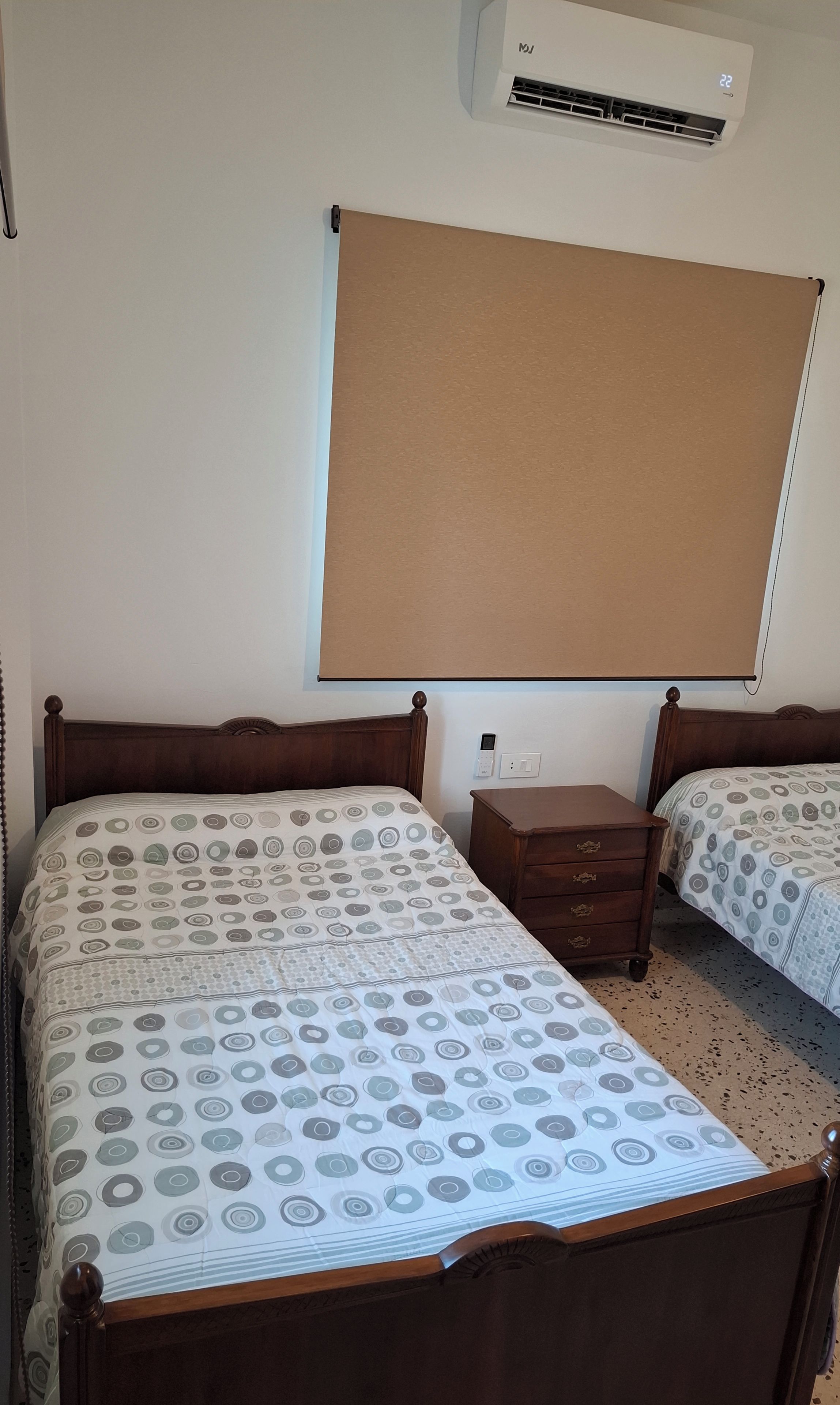2 single beds, AC (Air conditioning), extra mattresses, sheets & towels provided