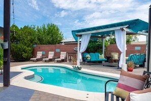 A swimming pool with lounge chairs and a covered seating area. - Shangri-La 6BR + Sleeps 16*Heated Pool/Spa (Tempe)
