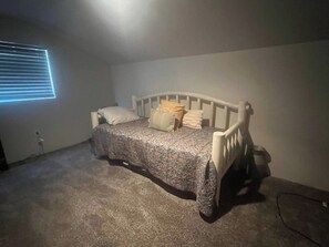 A single bed with a headboard, a bedside table, and a lamp. - Country-chic private guesthouse with laundry. (Queen Creek)