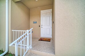 A residential entrance with a white door, a mailbox, and a doormat. - Beachwalk East Side-Near Nokomis Beach (Nokomis)