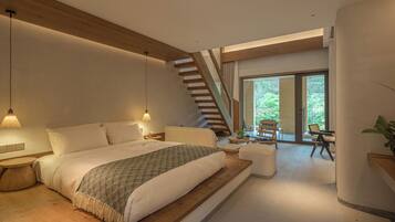 A modern bedroom with a large bed, a wooden staircase, and a view of the outdoors.