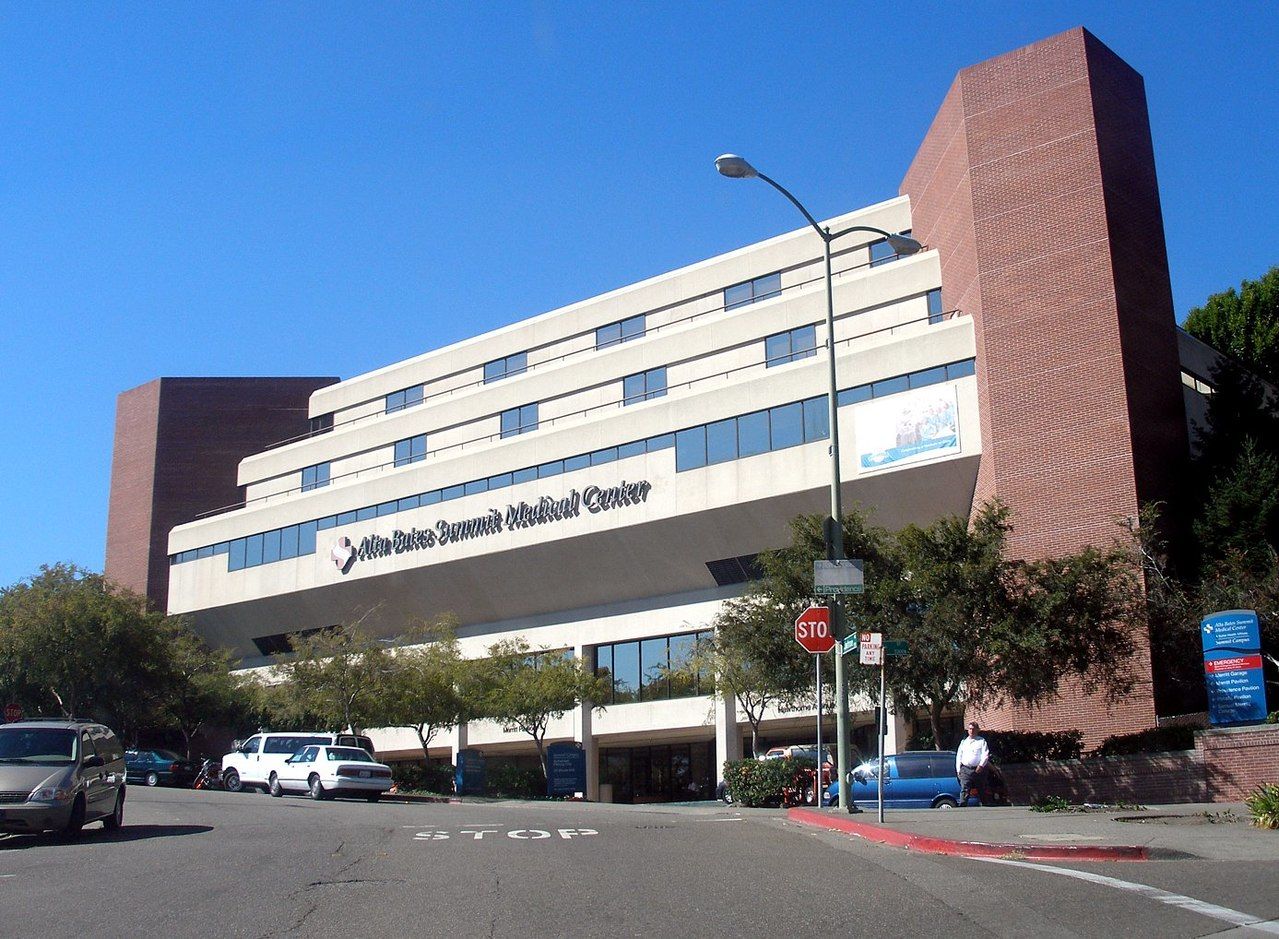 A multi-story building with a prominent sign for the 'Alvin S. Burroughs Medical Center.'