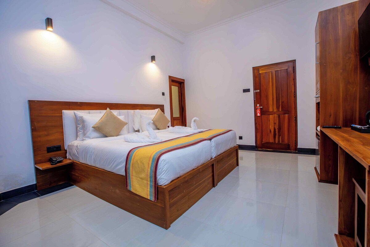 Habitación Deluxe con 1 cama matrimonial o 2 individuales, balcón, vista al jardín
