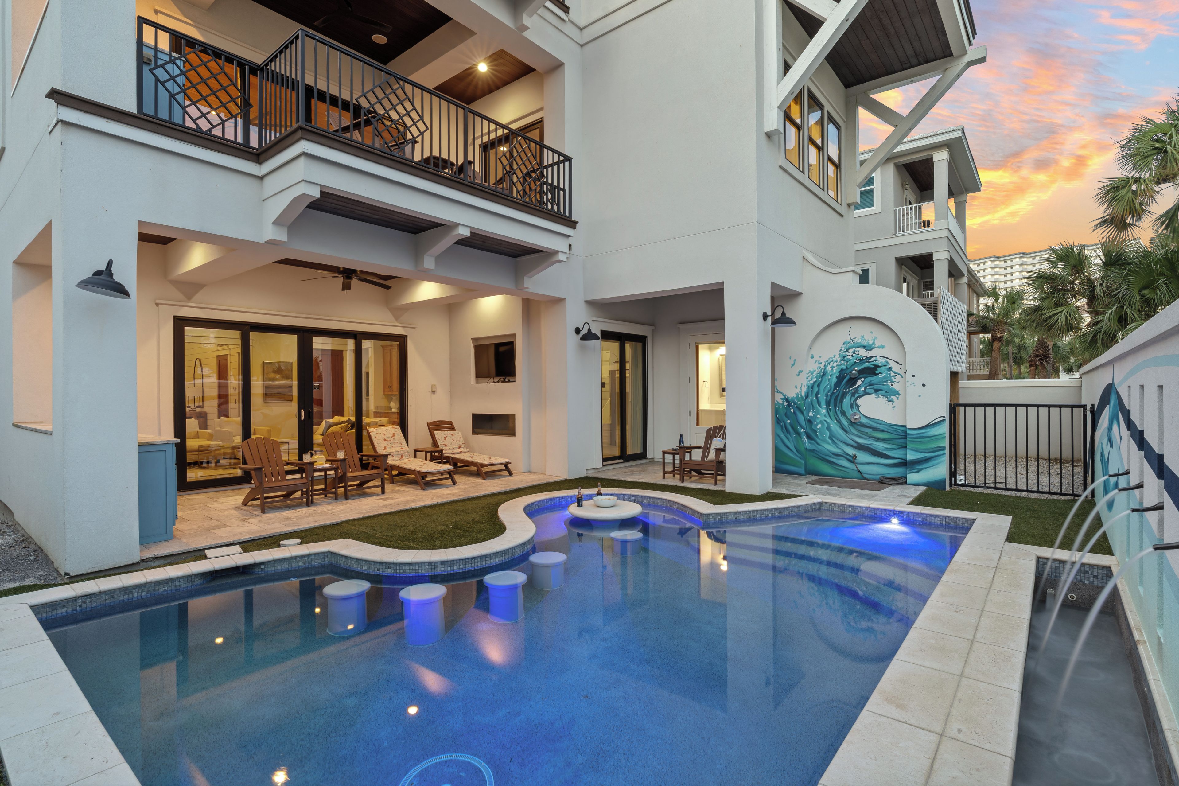 Make a splash in the private pool with in-water seating, a swim-up table, water features, and a covered lounge nearby.