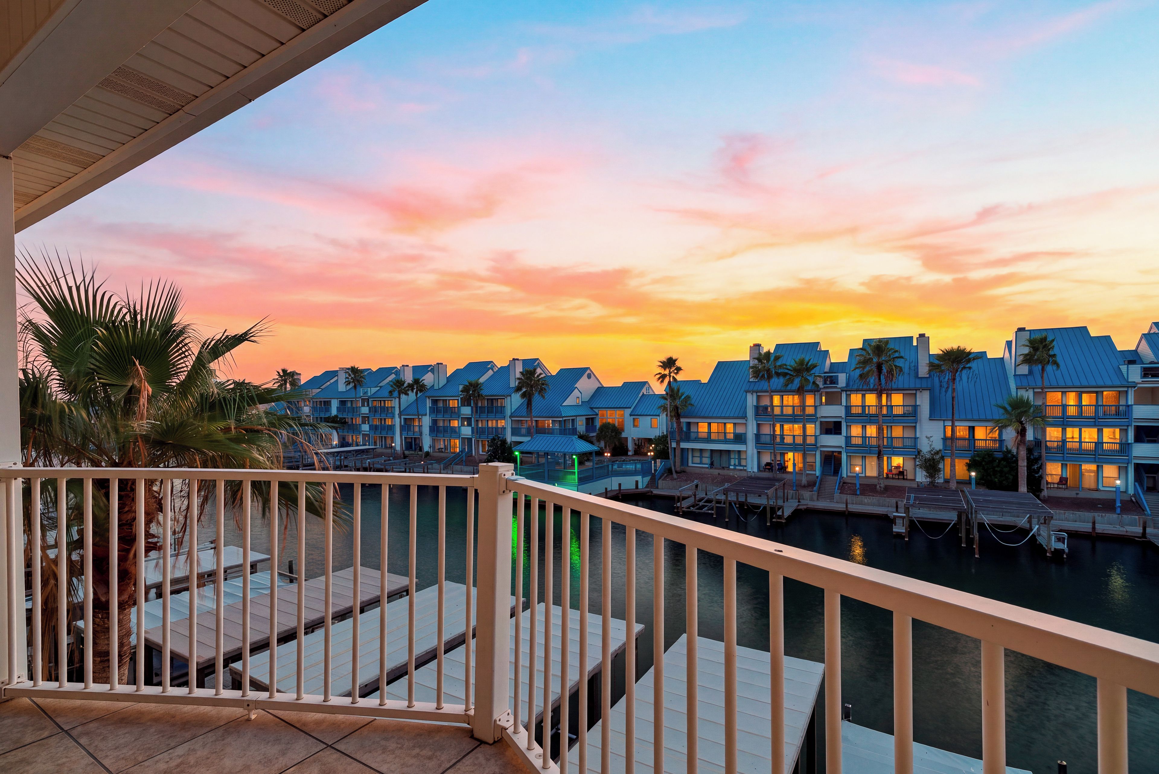Sunset views from the private balcony overlooking the waterfront community.