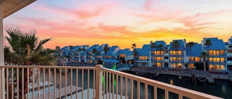 Sunset views from the private balcony overlooking the waterfront community.