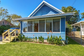 A single-story house with a gabled roof, large windows, and a front porch. - 2 Mi to Dtwn Pensacola: Historic Home w/ Patio! (Pensacola)