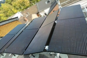 Solar panels installed on a rooftop. - Holiday home in Remagen with barbecue (Remagen)