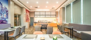 A modern hotel dining area with a central bar, seating arrangements, and a cityscape mural. - Echarm Hotel (Zhuhai)
