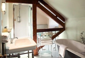 A bathroom with a sink, shower, and bathtub. - Collingwood Arms Hotel (Cornhill on Tweed)