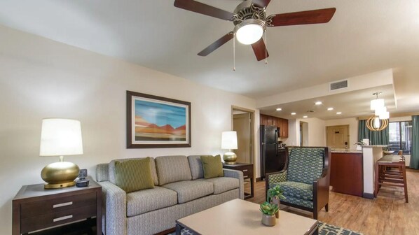 A modern living room with a sofa, two lamps, a ceiling fan, and a painting on the wall. - Your Desert Oasis Awaits at Holiday Inn Club Vacations Scottsdale Resort- 2 Bd. (Scottsdale)