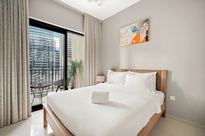 A hotel room with a large bed, a view of a cityscape through a balcony, and a painting on the wall. - Near Metro  1BR  Pool view & Prime Location (Dubai)