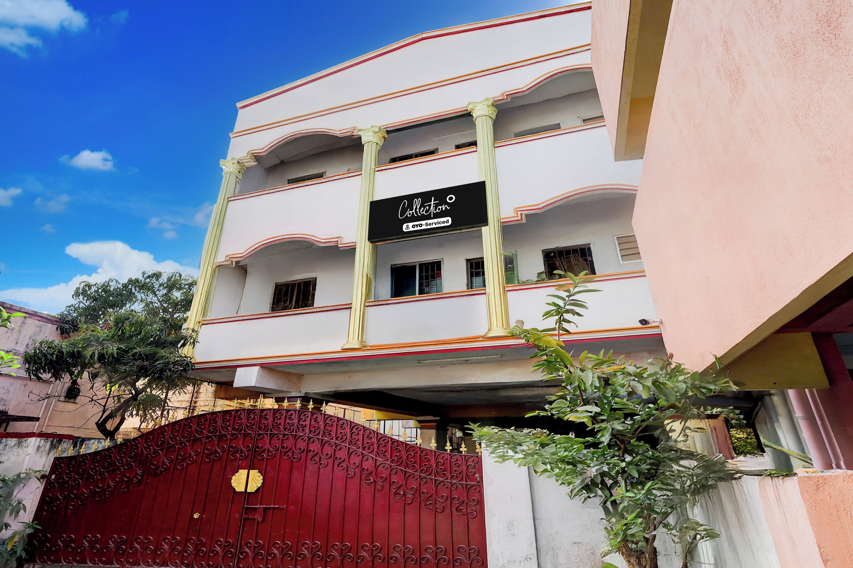 A multi-story building with a sign indicating it is serviced by OYO.