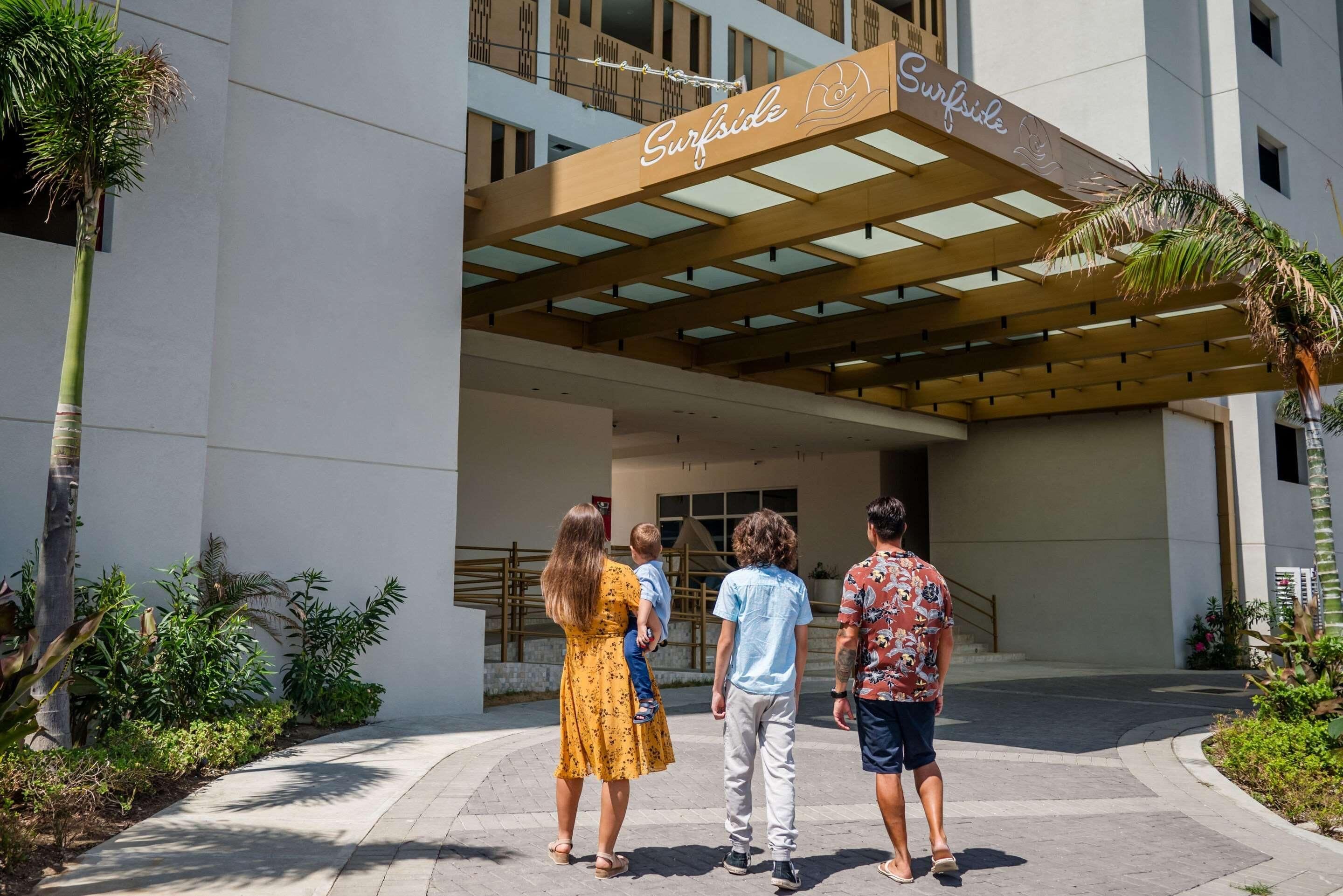 A hotel entrance with a sign reading 'Surfside.'