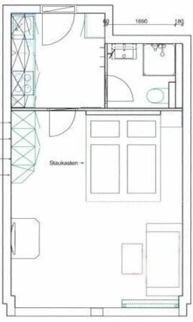 A floor plan with a kitchen, bathroom, and a living area.