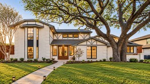 A modern two-story house with a large tree in the front yard. - Richardson Retreat - Pool, Hot Tub & Fire Pit (Richardson)