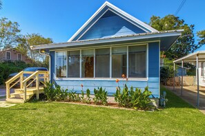 A single-story house with a gabled roof, large windows, and a front porch. - 2 Mi to Dtwn Pensacola: Historic Home w/ Patio! (Pensacola)