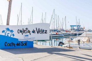 A marina with a sign for 'Caleta de Velez' and 'Costa del Sol'. - Mar Y Sol Caleta Panorama 3A (Algarrobo-Costa)