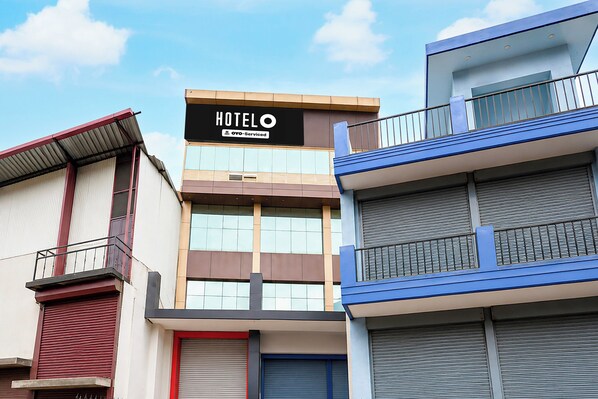A hotel building with a sign that reads 'HOTEL' and 'YO-Serviced'. - Hotel Station Formerly Star Residency (Dehradun)