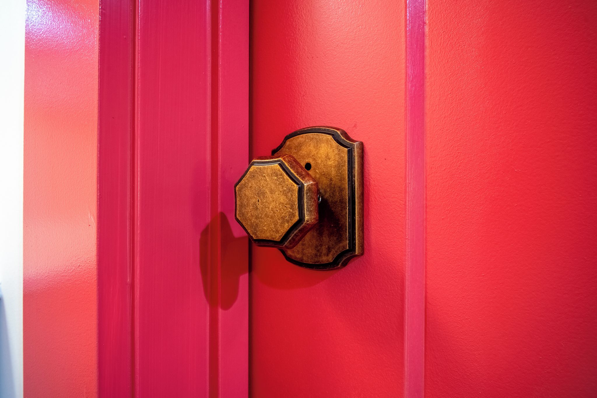 A red door with a brass door knocker.