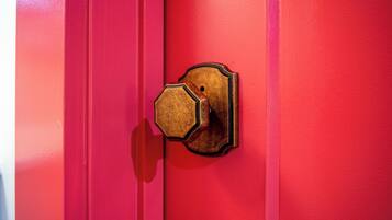 A red door with a brass door knocker.