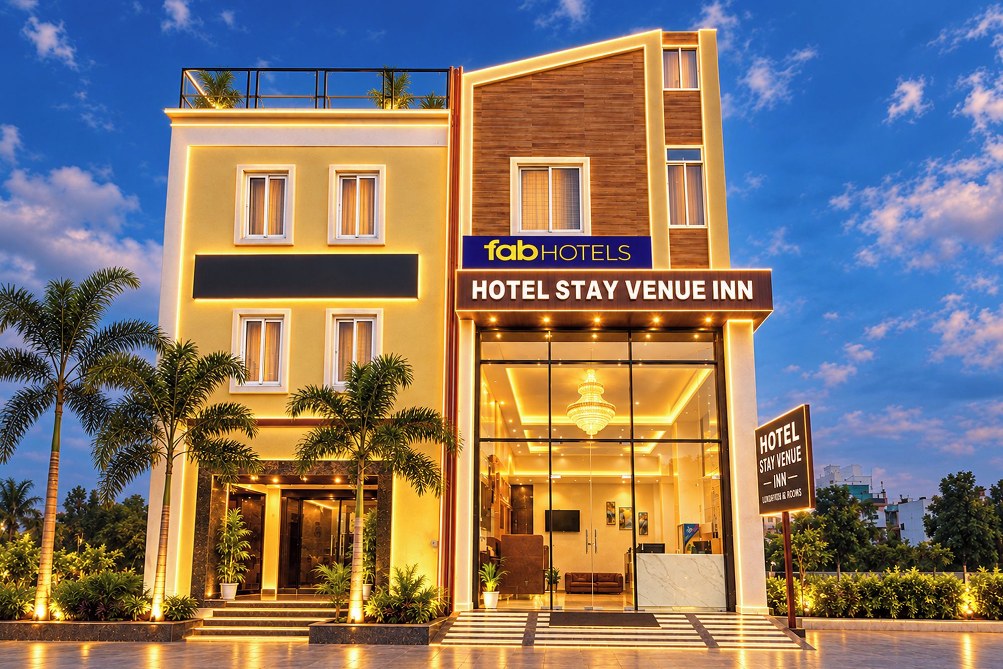 Um hotel moderno com uma placa indicando 'fab hotels HOTEL STAY VENUE INN'.