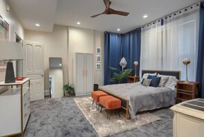 A bedroom with a bed, bedside tables, a ceiling fan, and a window with curtains. - Minutes to Capitol & UPMC  Monthly w/ Parking. Perfect for Professionals; 2nd Fl (Harrisburg)