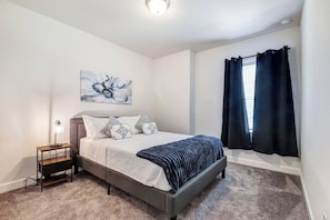 One of the 3 queen bedrooms on the 2nd floor.  This bedroom includes a private bathroom. - Stylish 4Bed -3.5 Bath - King bd -Grill - Office- Garage Parking (Richmond)