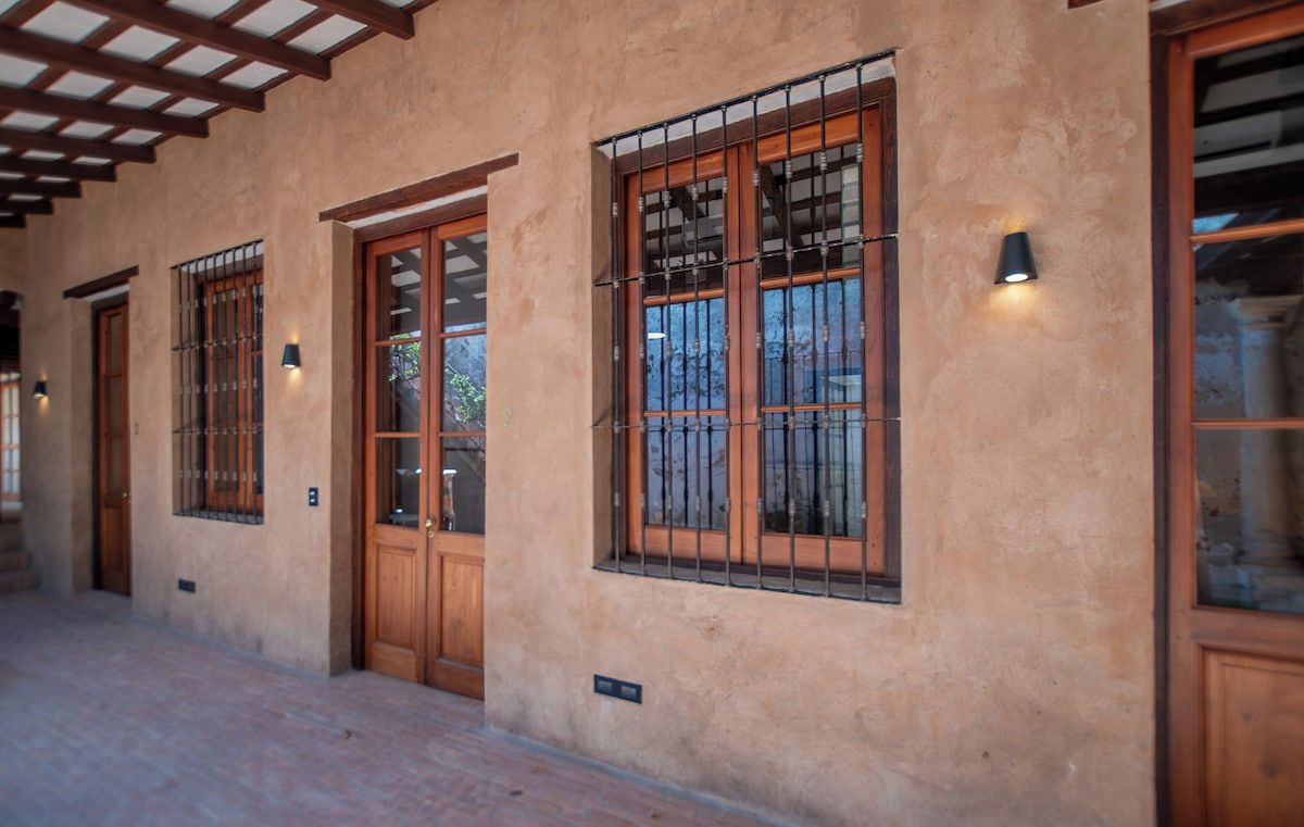 Courtyard corridor with bedroom doors